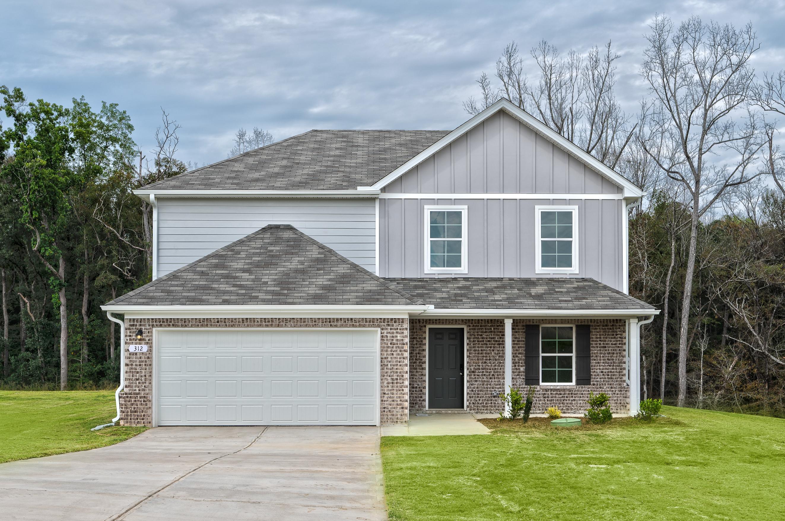 A house with a garage with American Gothic House in the background.