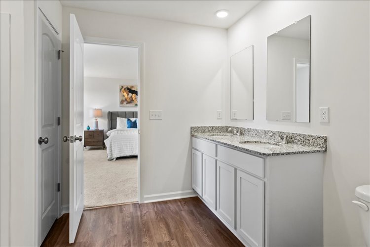 A bathroom with a marble countertop.