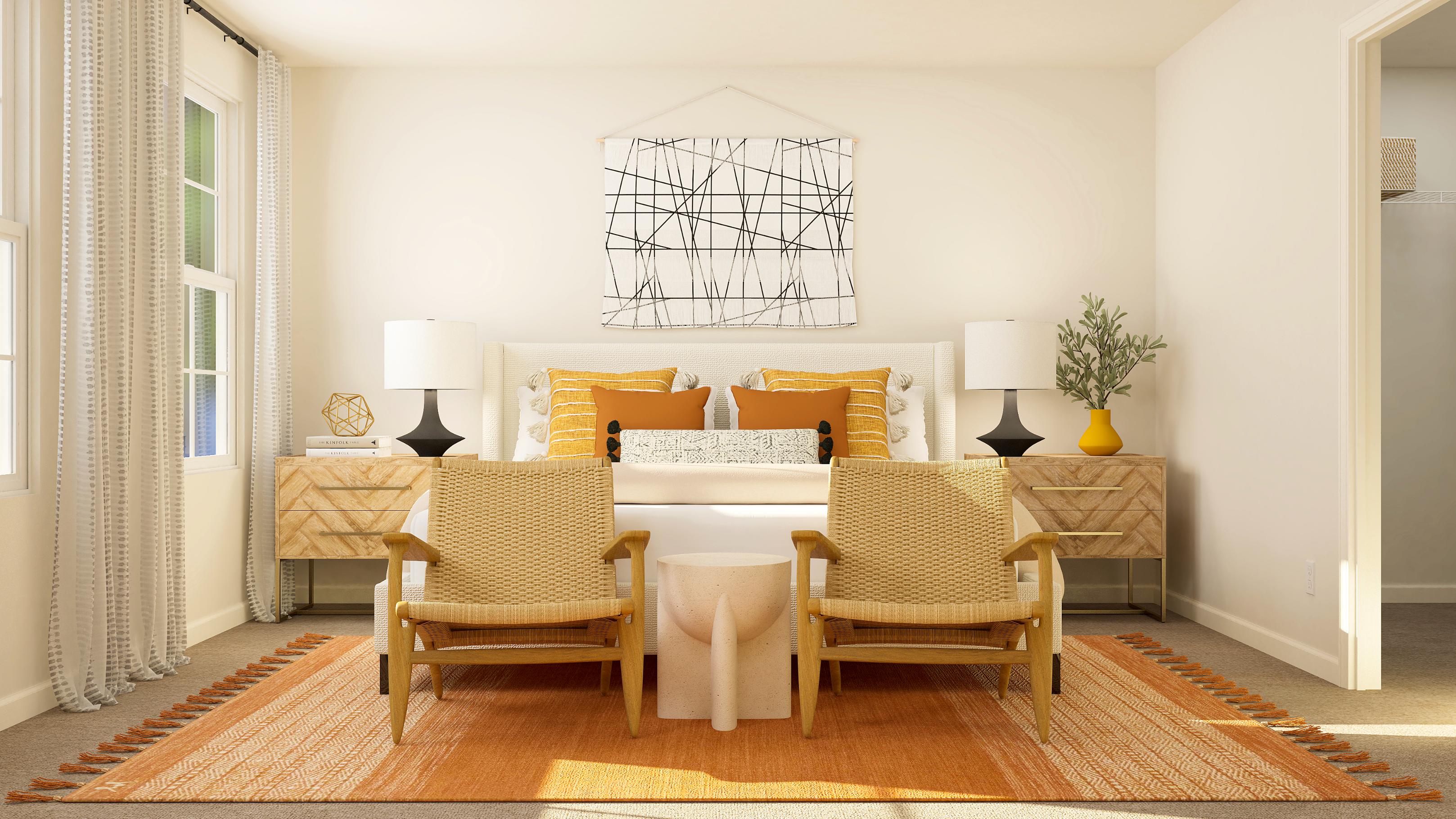 A room with a couch and chairs.