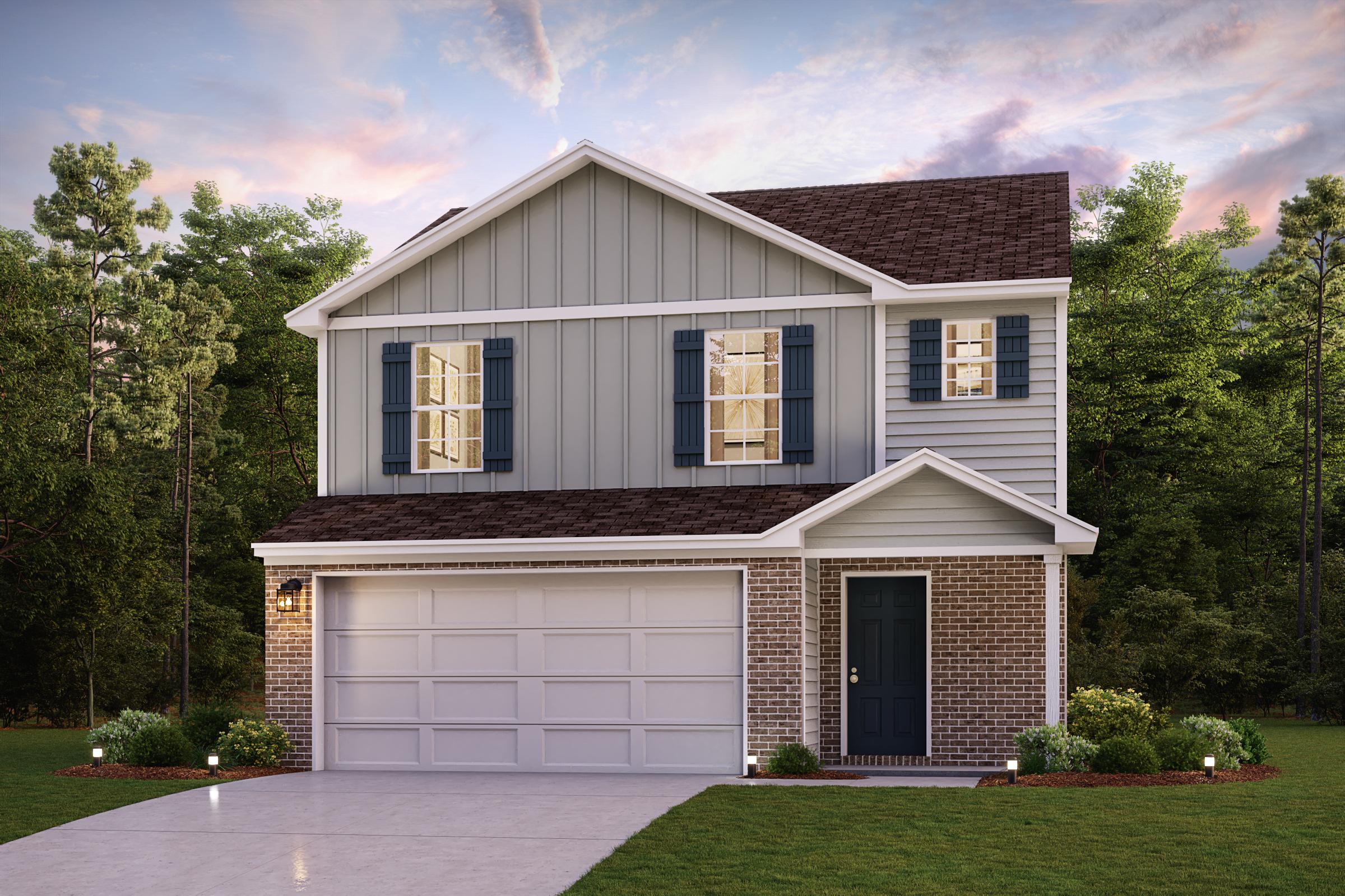 A house with a garage and trees in the back.