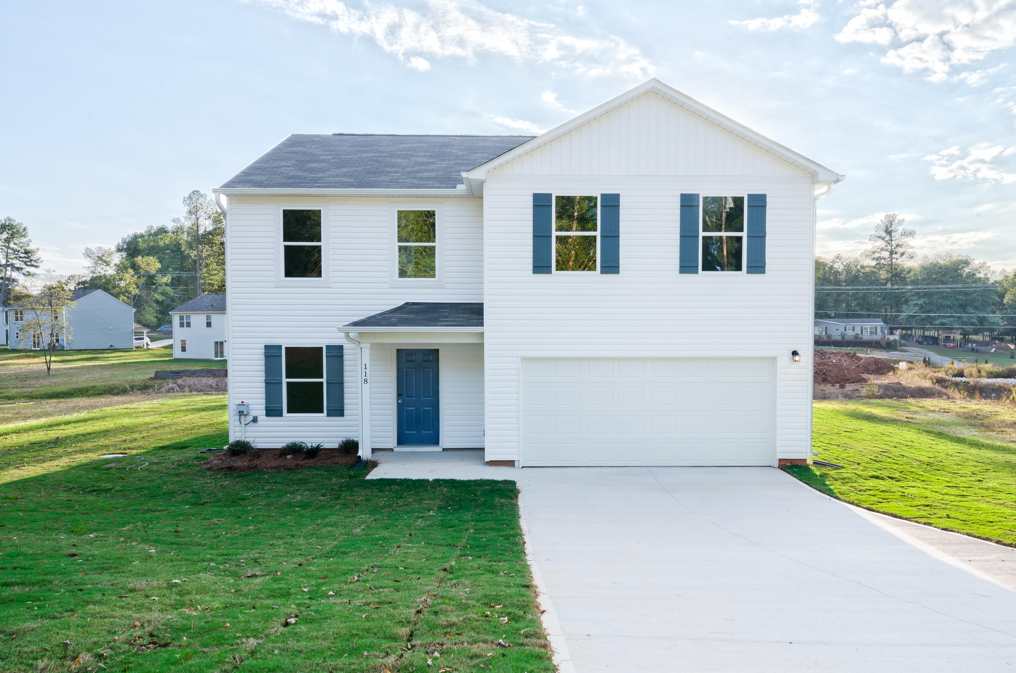 A white house with blue shutters.